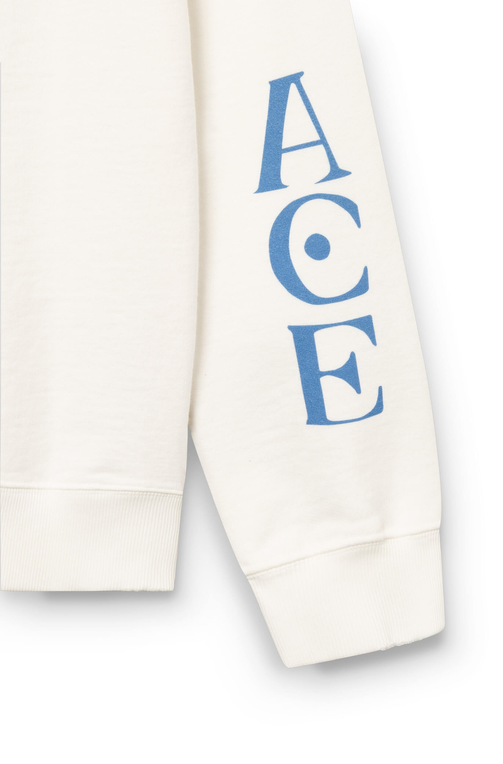 Zoom sur la manche du sweat-shirt en coton blanc cassé teint artisanalement et imprimé tigre ace Paris