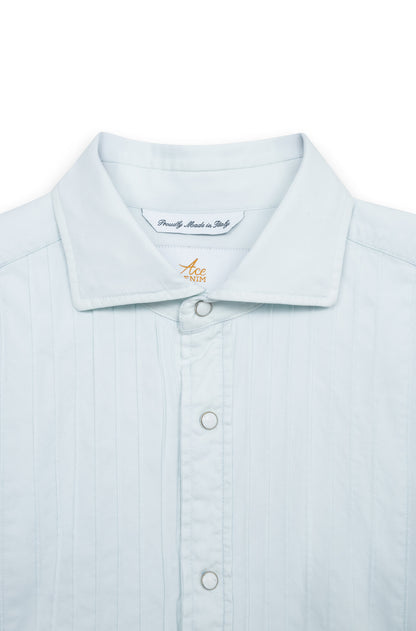 Detail of the pearl snap buttons on the cuff of the washed cotton shirt.