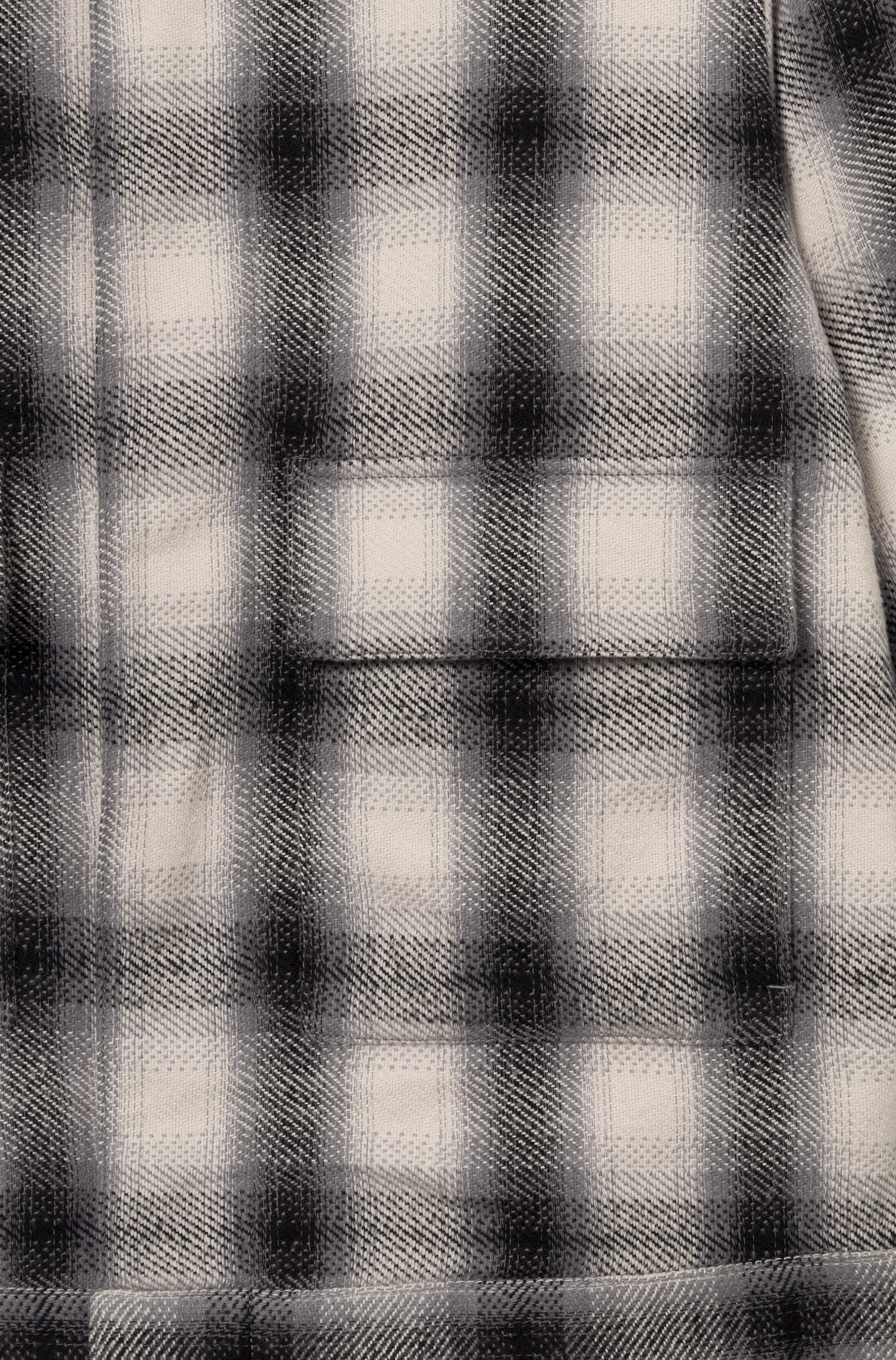 Poche de la veste en coton avec motif à damier blanc et noir pour homme