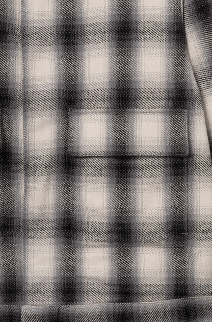 Poche de la veste en coton avec motif à damier blanc et noir pour homme